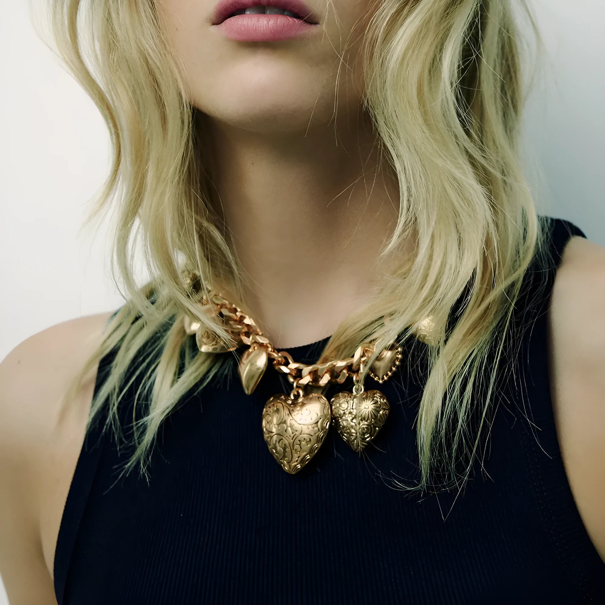 Carved heart pendant necklace in alloy metal with adjustable chain length between 41cm and 50cm