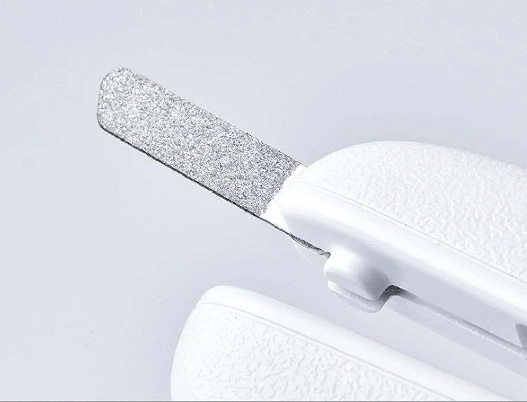 White LED pet nail clippers with a transparent anti-splash guard and an integrated nail file on a grey background.