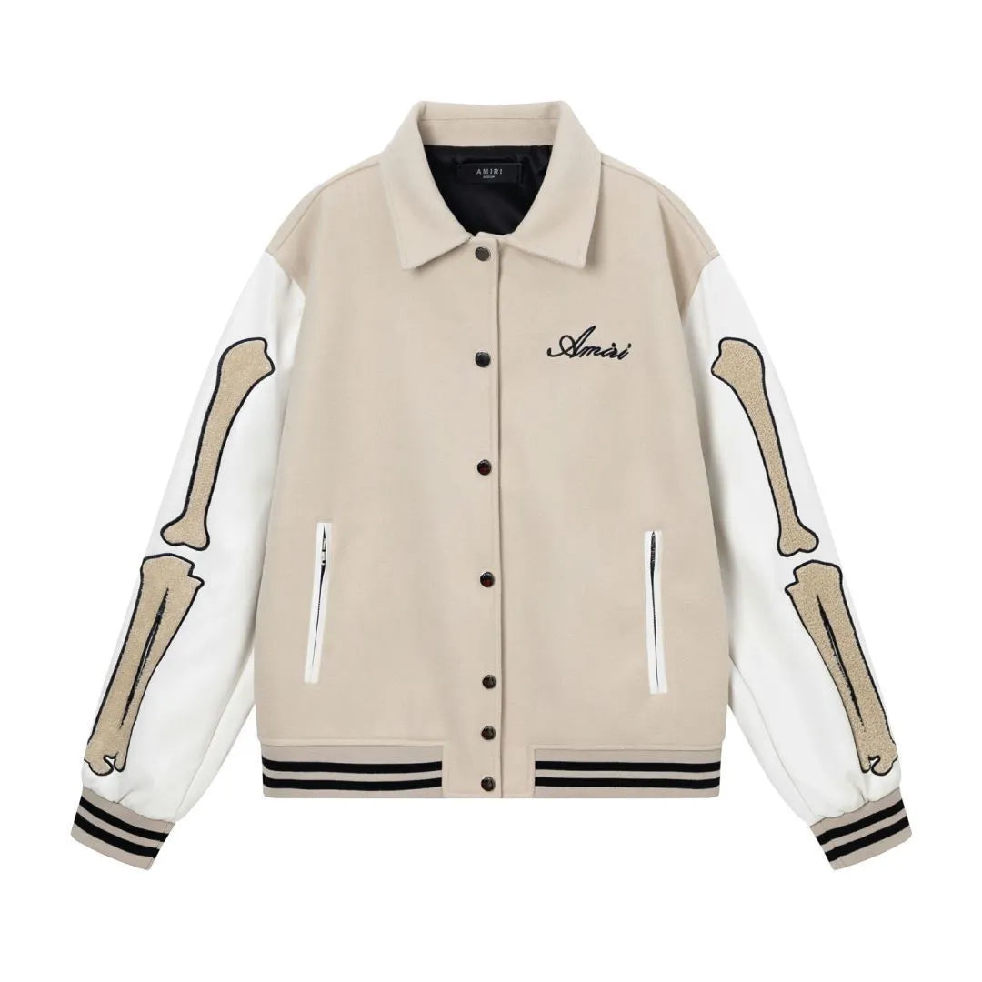 Apricot and brown woolen jacket with embroidered bone pattern detail on front.