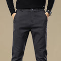 Men's fleece-lined slim fit tapered casual pants in black cotton fabric