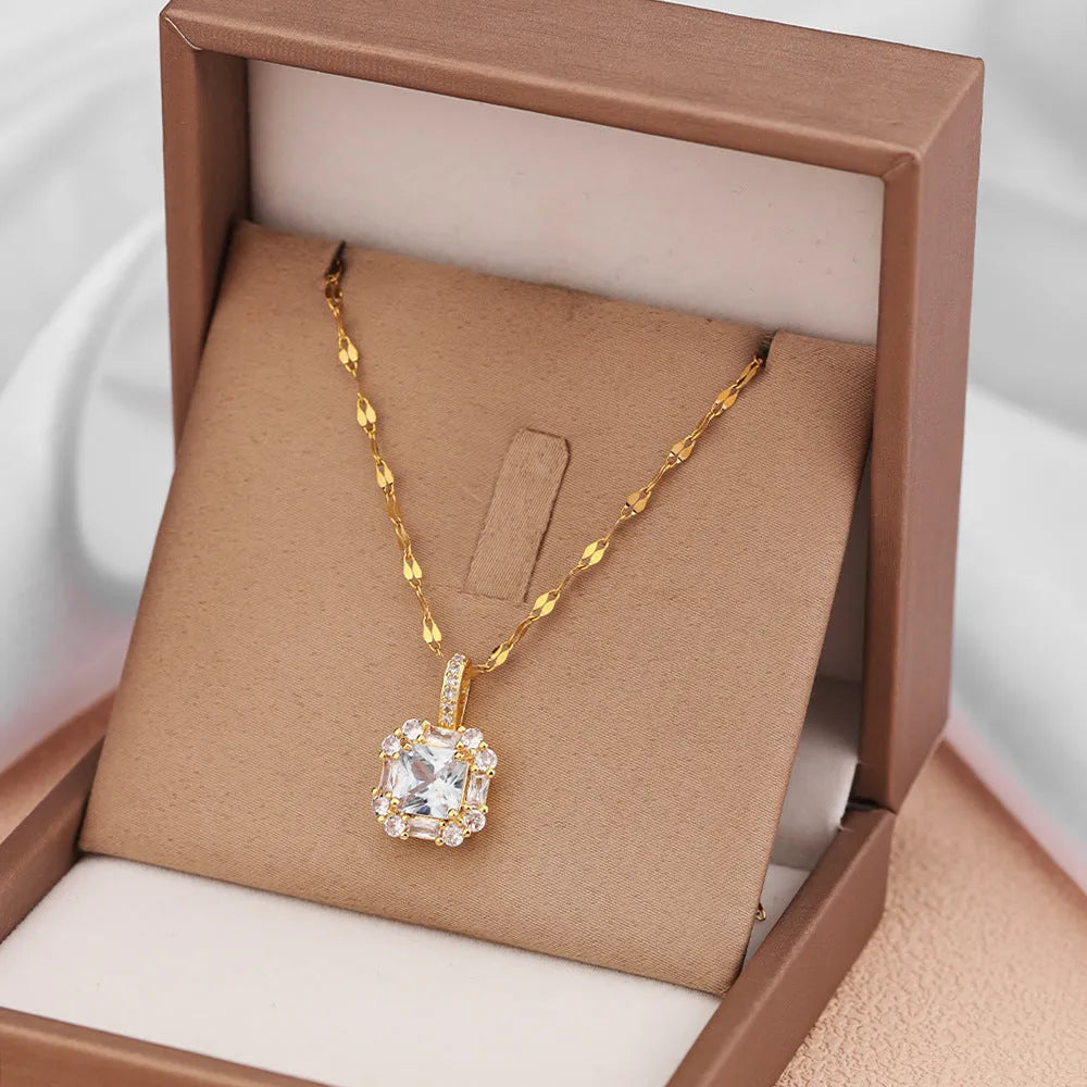 Gold titanium steel clavicle necklace with geometric quadrilateral pendant containing zircon stones