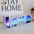 Rainbow-style plastic LED LOVE light decoration for Valentine's Day and weddings.