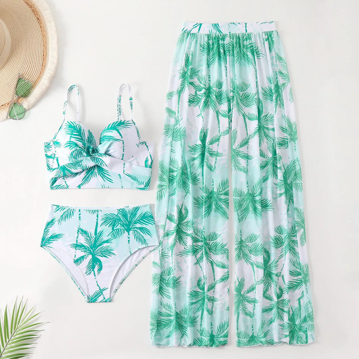 Women's bikini three-piece suit with printed pattern, available in black, blue, and emerald green colours
