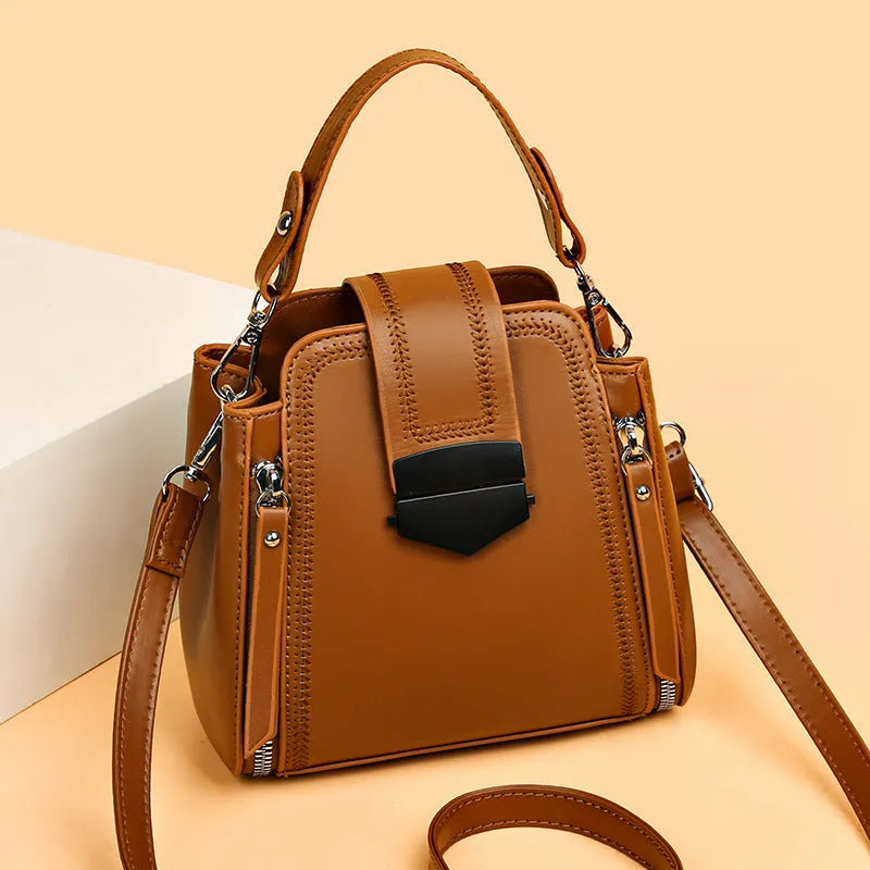 Small square vertical handbag in soft textured PU leather with zip closure and sewing thread detail