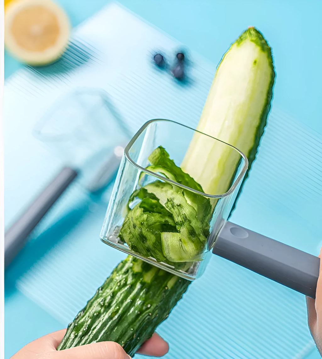 A creative stainless steel peeler with a coloured PP handle, shown in green, grey, and red options.