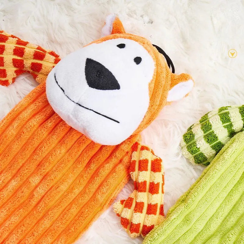 Green and orange plush dog toy with squeaker for aggressive chewing and teeth grinding