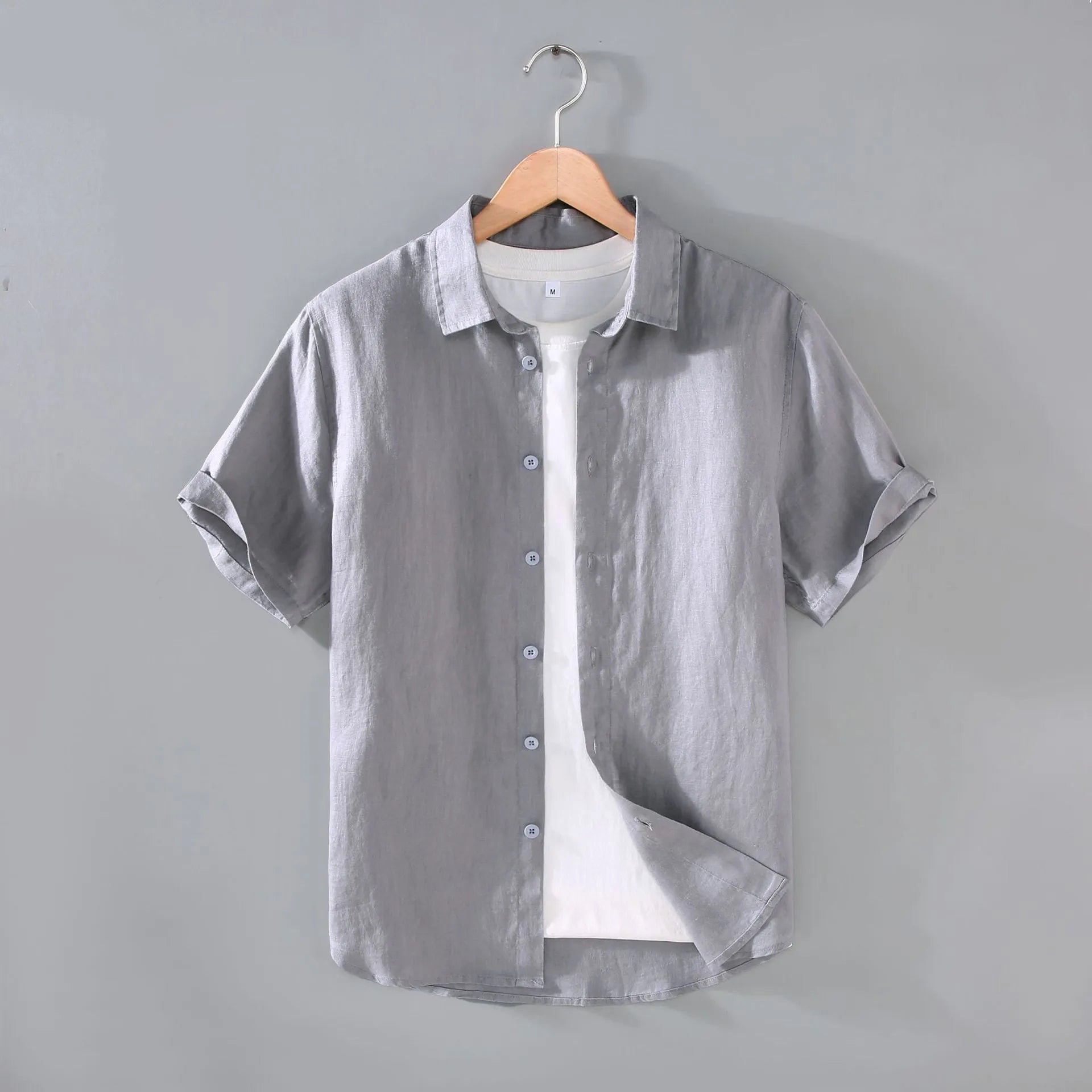 Men's casual short-sleeved linen shirt in regular fit showing colour options including apricot, dark blue, and gray