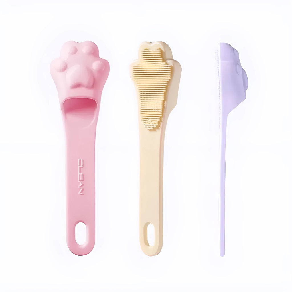 Silicone fingertip toothbrush for pets in pink, purple, and yellow, shown on a finger.