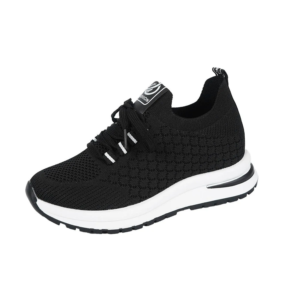 Women's black and white mesh platform sneakers with lace-up front and rubber sole