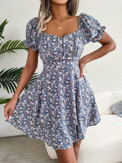 A stylish floral mini dress with a swing silhouette, featuring a high-waist design, short sleeves, and a vibrant floral print.