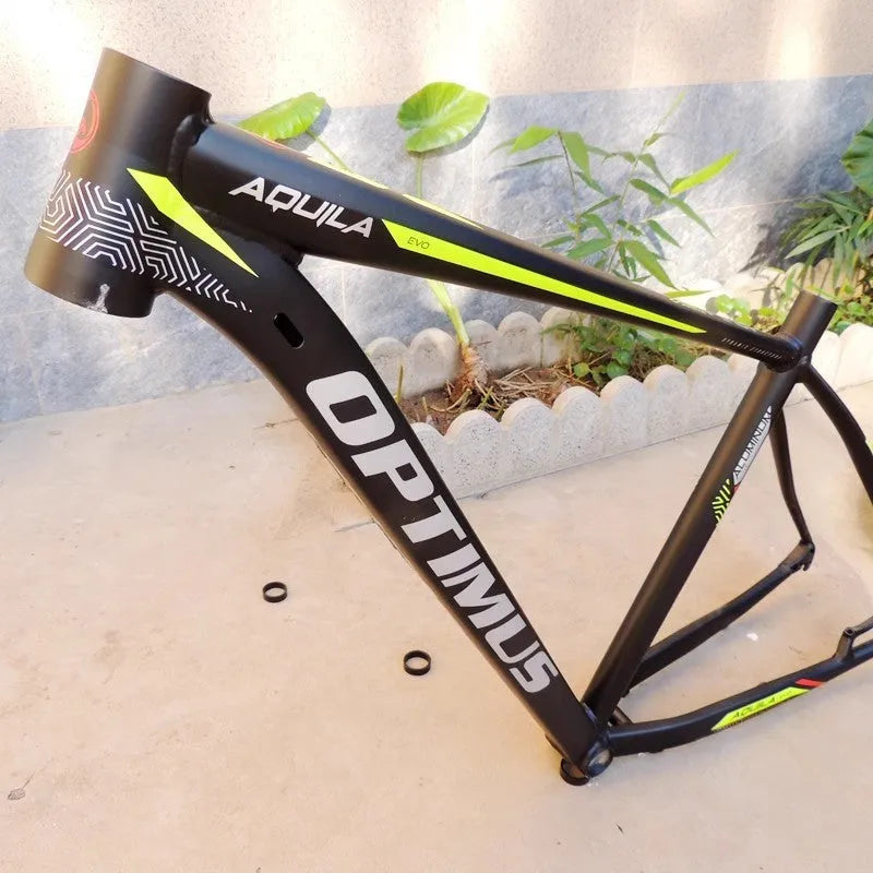29-inch aluminium mountain bike frame in black green colour with disc brake mounts and internal cable routing