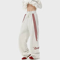 Men's striped loose straight-leg casual pants in black, white gray, or navy blue, sizes M to XXXL.
