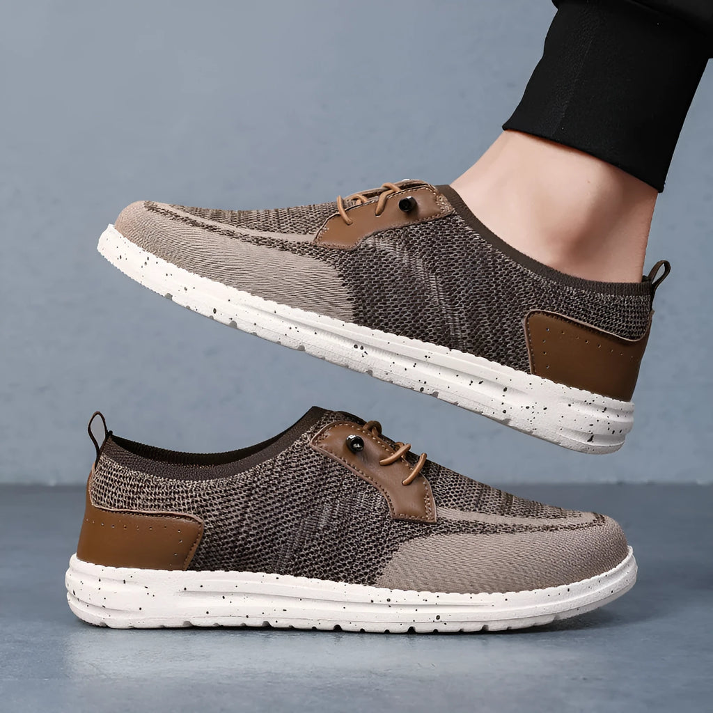 Men's black laceless canvas shoes with low-top design and round toe