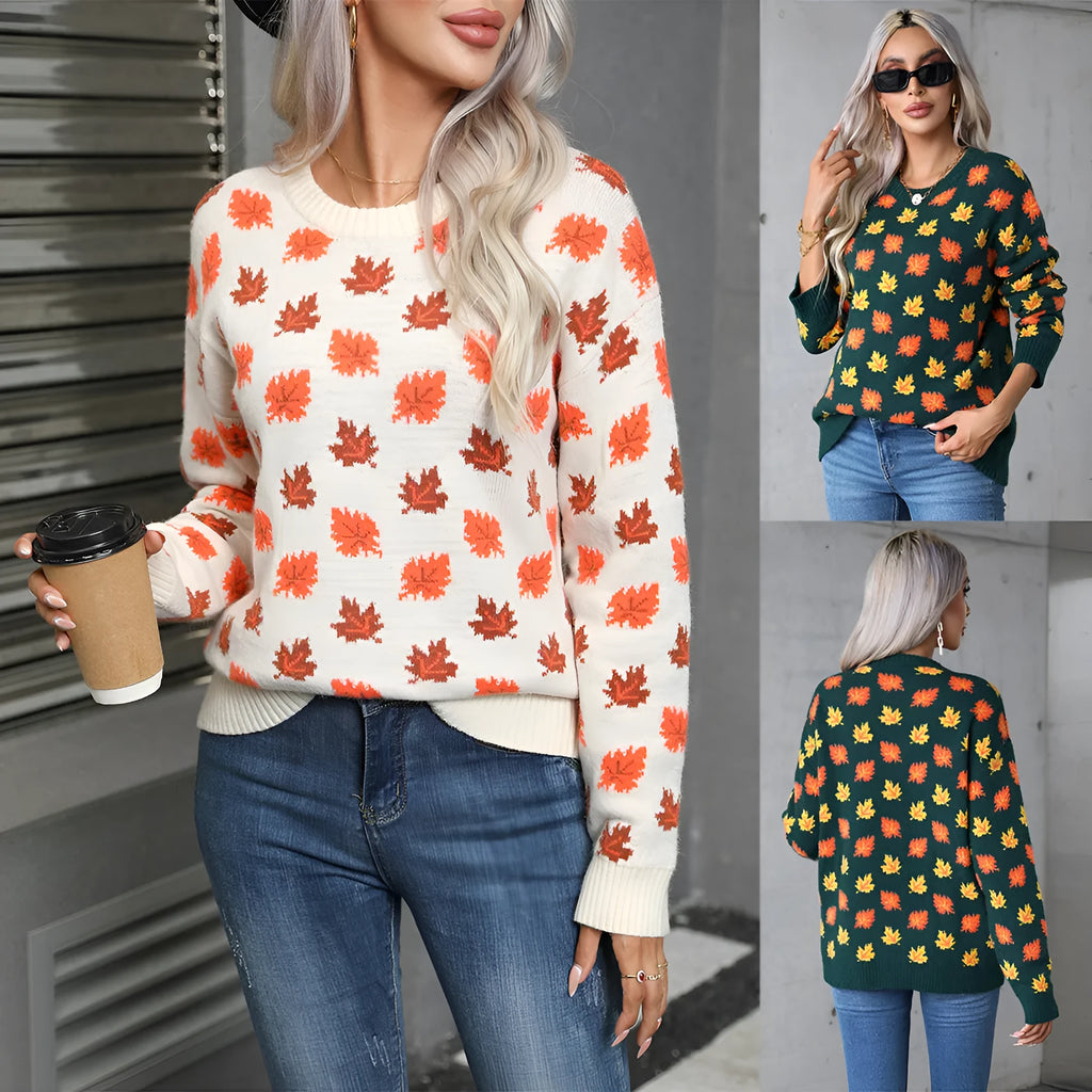 Loose fit beige Christmas sweater with a large dark maple leaf print on the front.