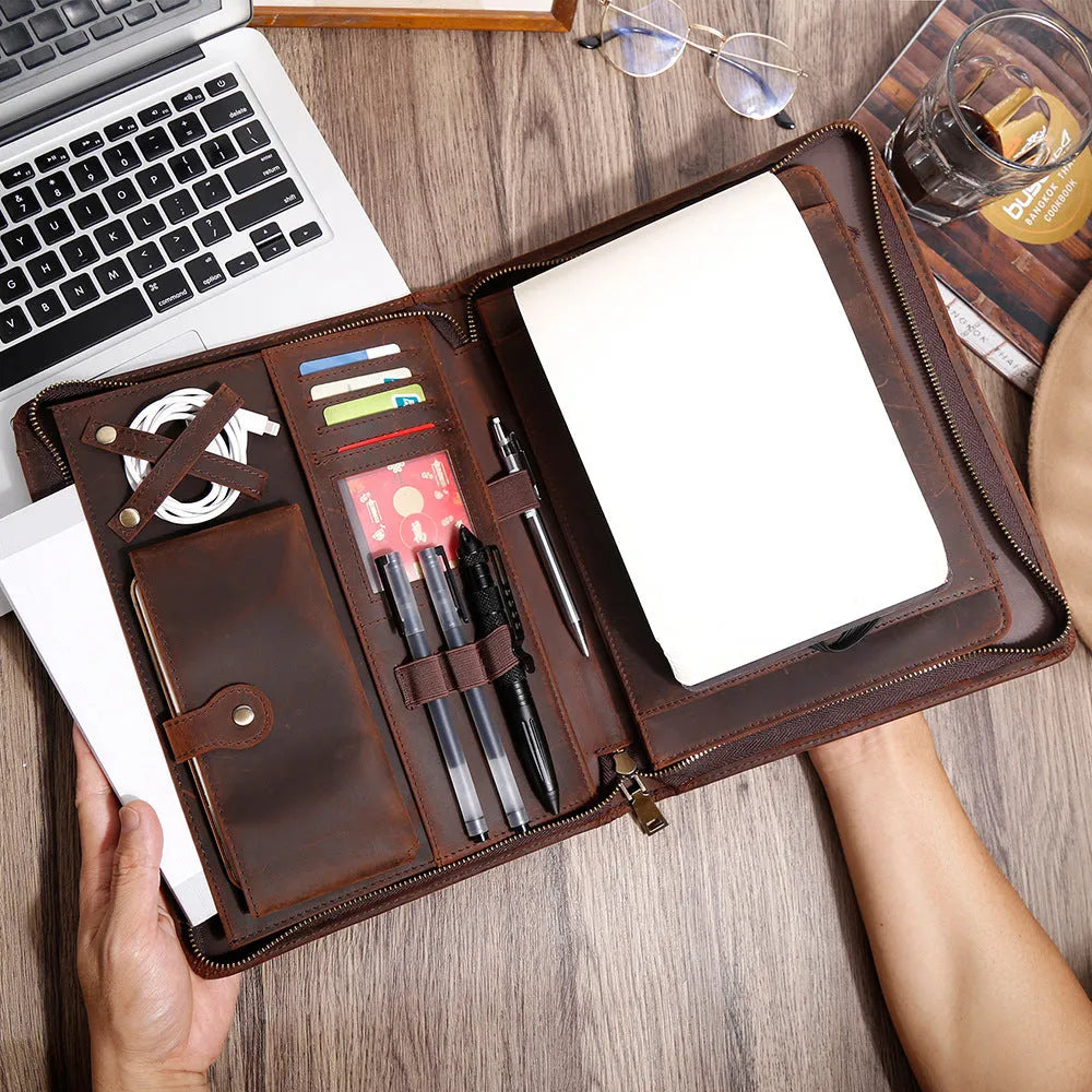 Genuine cowhide leather computer protective case with organisational compartments.