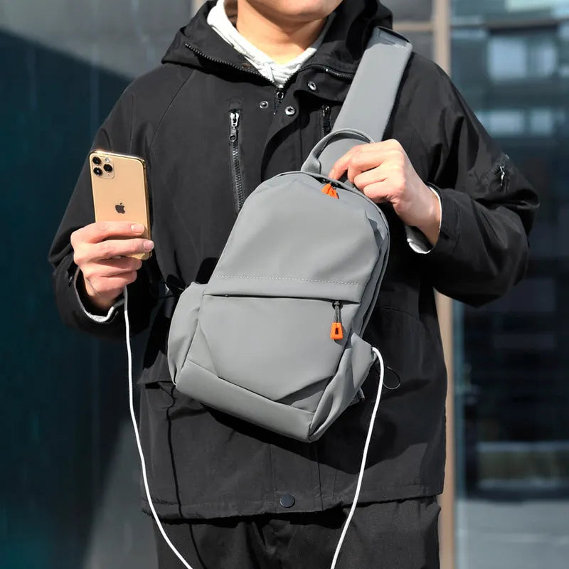 Black mens waterproof polyester crossbody bag with adjustable shoulder strap