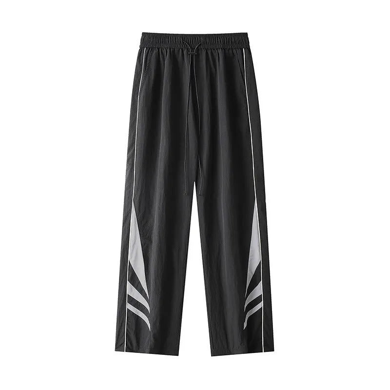 Men's straight-leg black casual sports trousers with a button fly and elastic mid-waist.