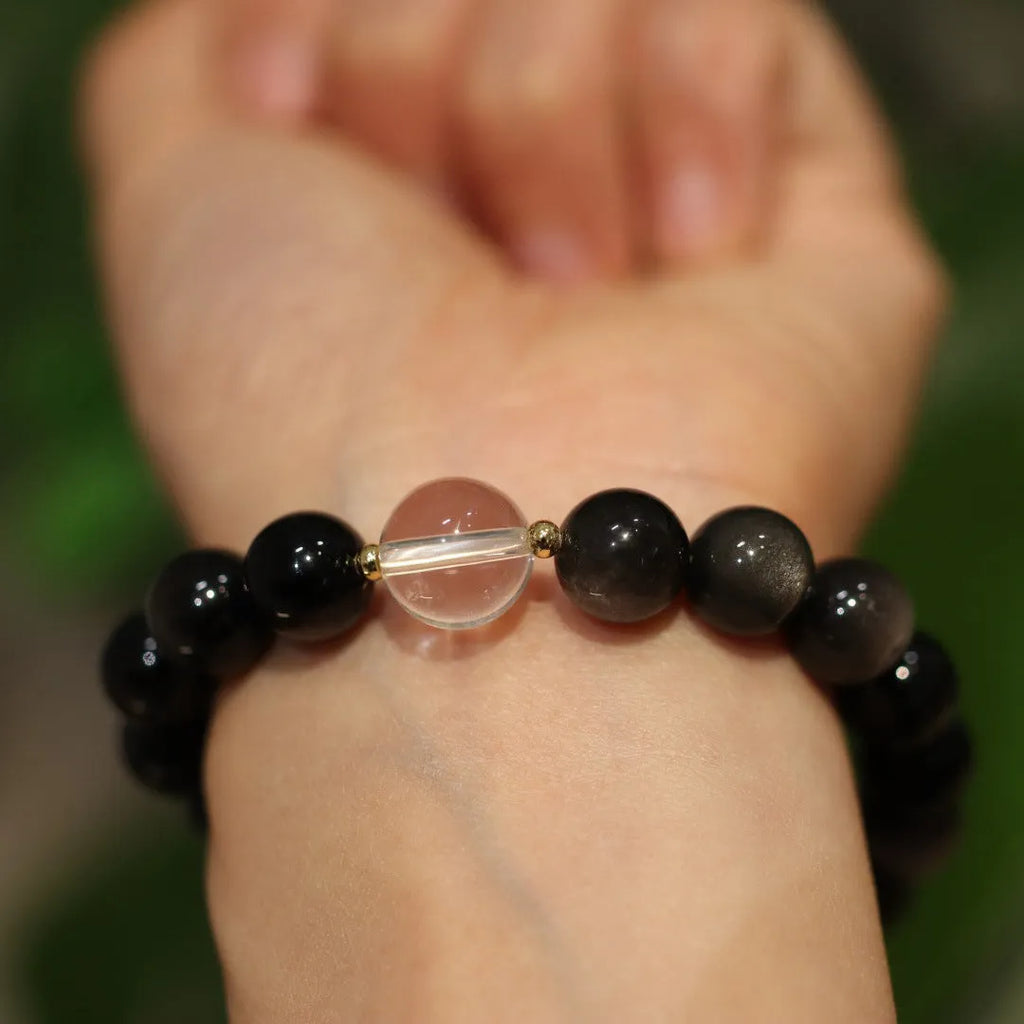 White crystal bracelet with cat eye obsidian stone in geometric Chinese design