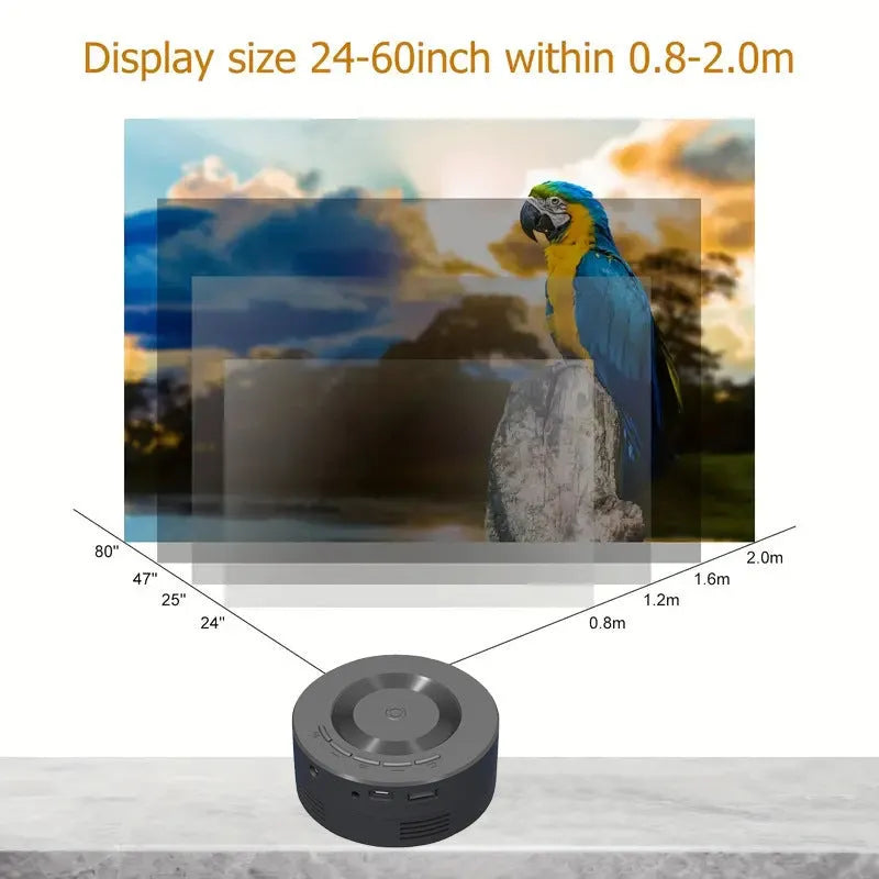 Black portable 1080p wired mobile projector with USB power cable on a surface