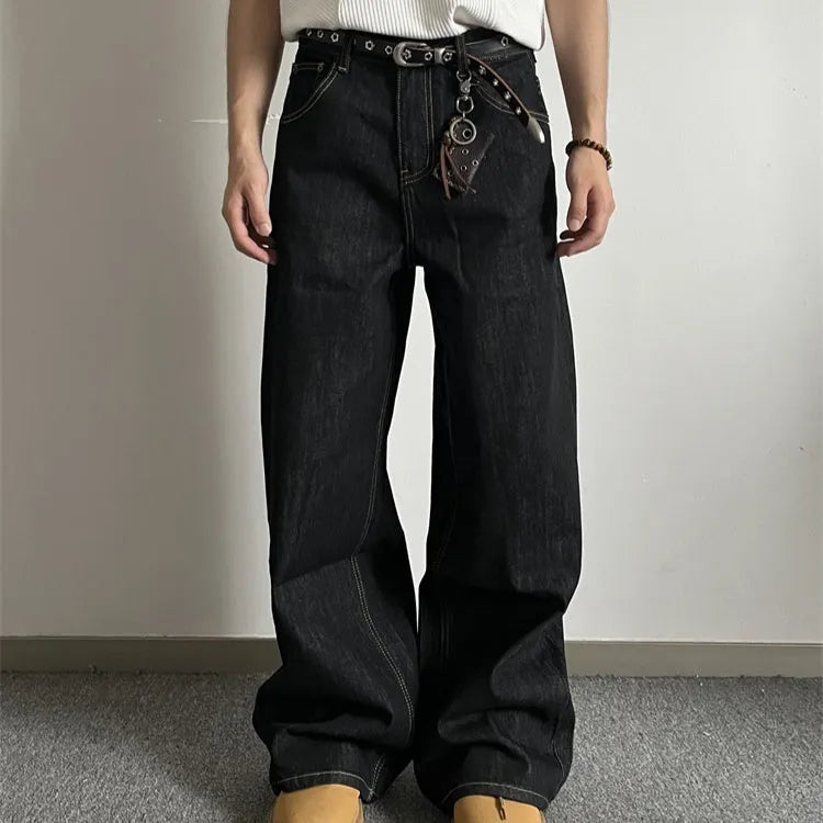 Black retro-style loose-fit straight-leg denim jeans on a hanger.