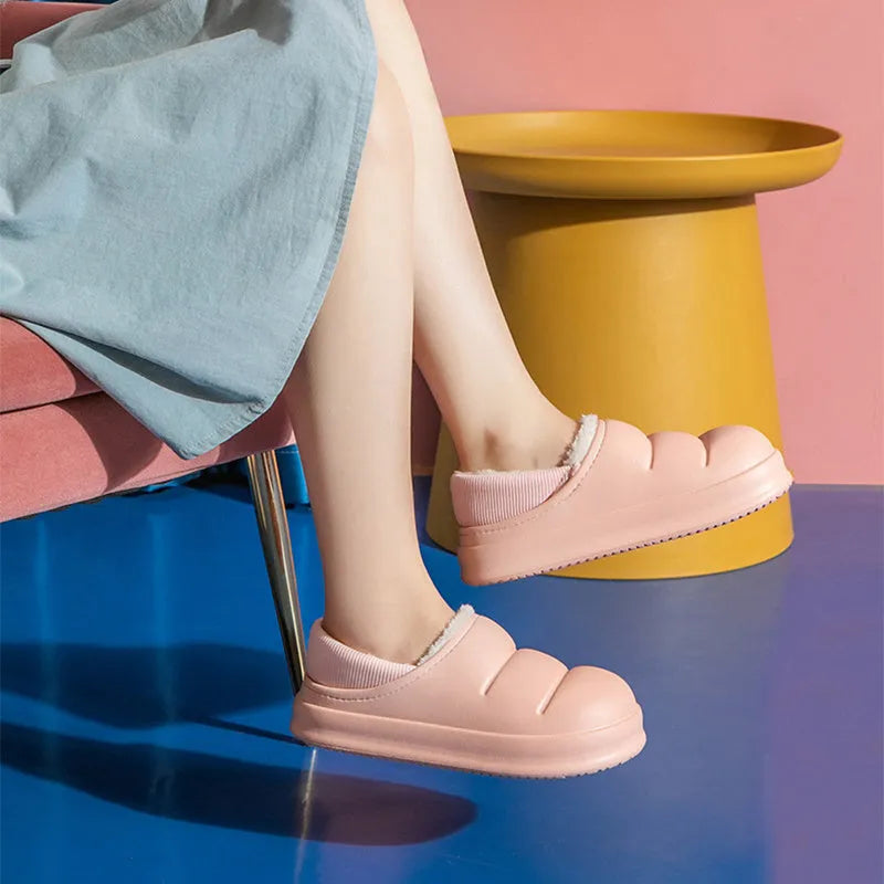 Yellow waterproof EVA garden slippers with a plush lining and textured non-slip sole.