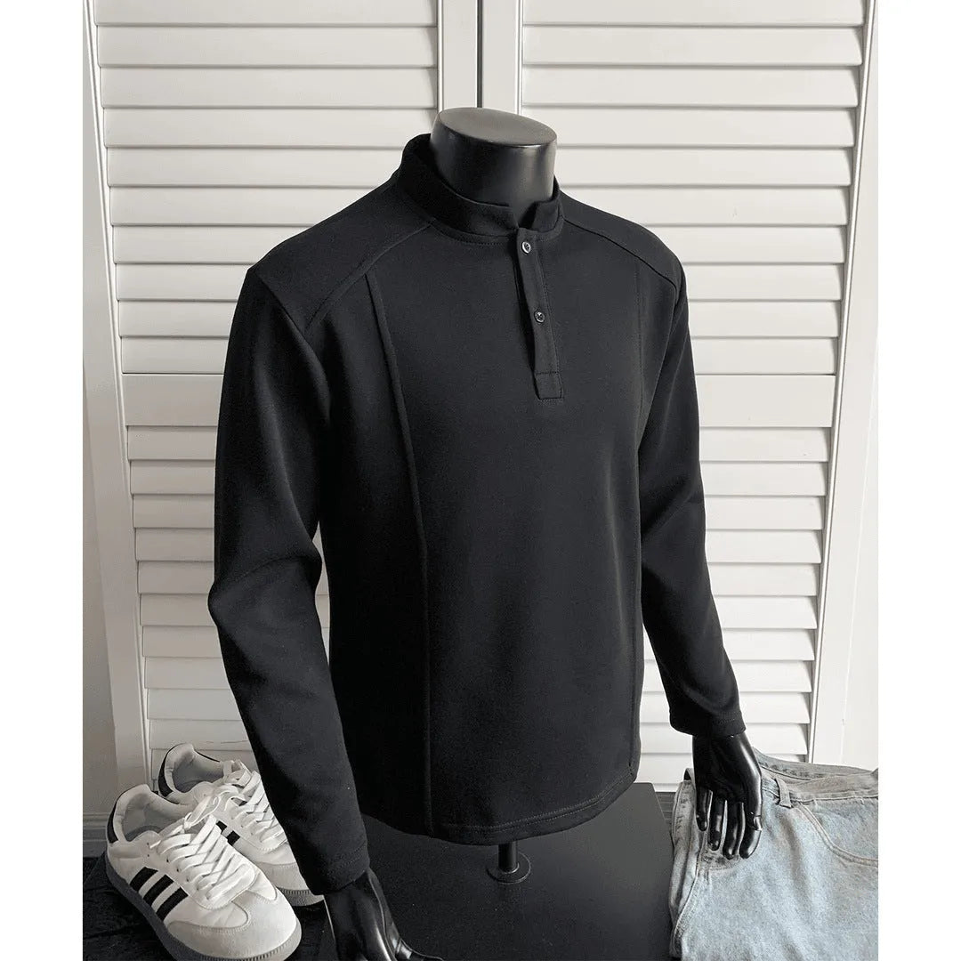 Men's grey polo shirt with patchwork detailing on shoulders and stand-up collar