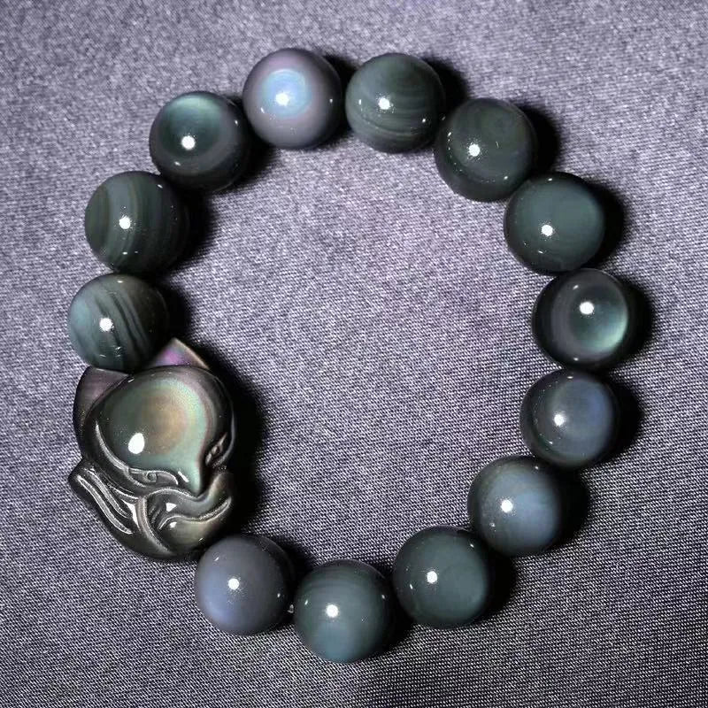 Obsidian bracelet carved with fox or zodiac animal design in cartoon style