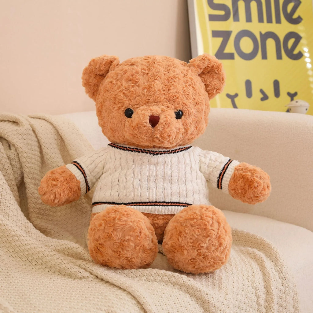 White sweater teddy bear plush doll with PP cotton filling and cloth velvet cover, shown in front view
