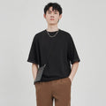Men's loose fit drape knit T-shirt in polyester blend available in black, brown and white colours