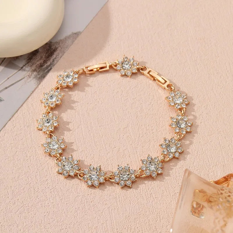 Luxury style bracelet with coloured gems and floral design on zinc alloy with electroplated finish