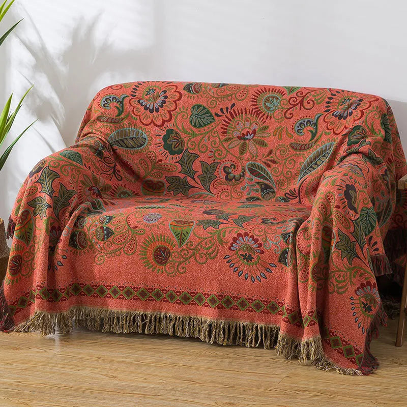 Cotton gauze towel quilt with tassels in beige flower pattern on a bed