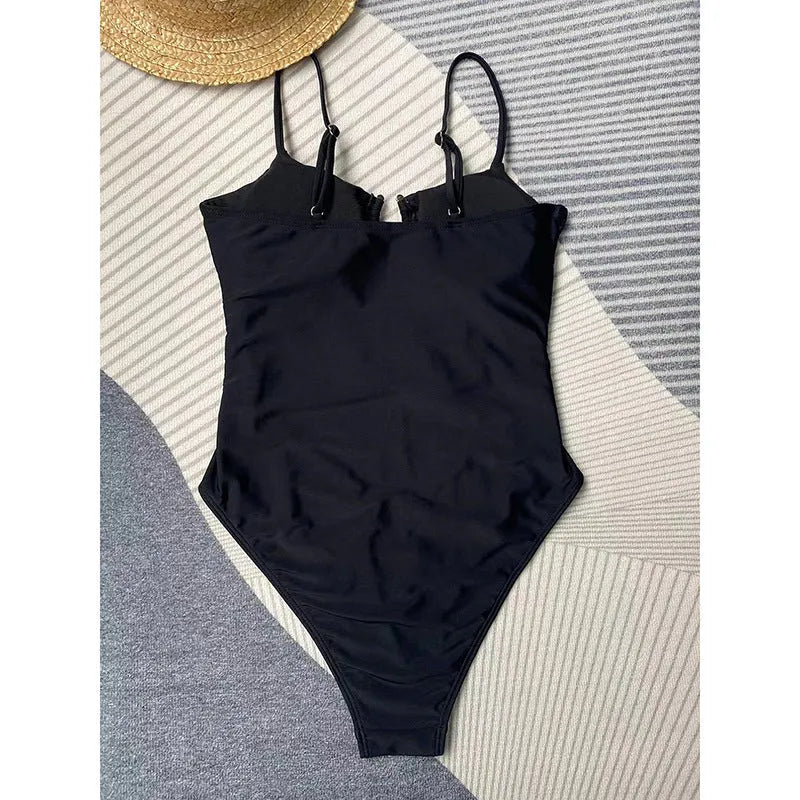 Black women's one-piece swimsuit with solid colour design and bikini style