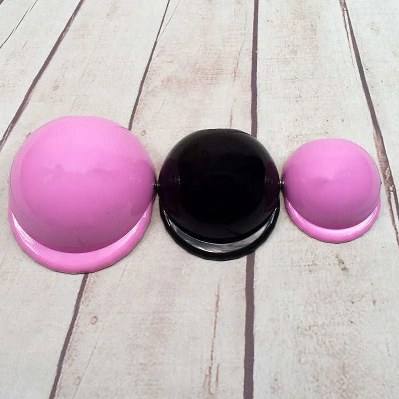 Plastic dog motorcycle helmet in pink colour showing size options for small medium large dogs