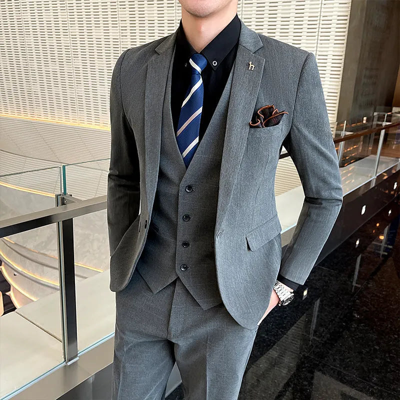 Slim fit men's business suit in black or dark grey with cotton blend fabric construction