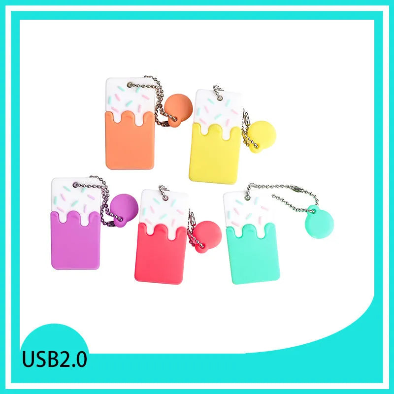 Cartoon cake pendant USB flash drive with PVC case, anti-loss attachment and 32GB capacity.