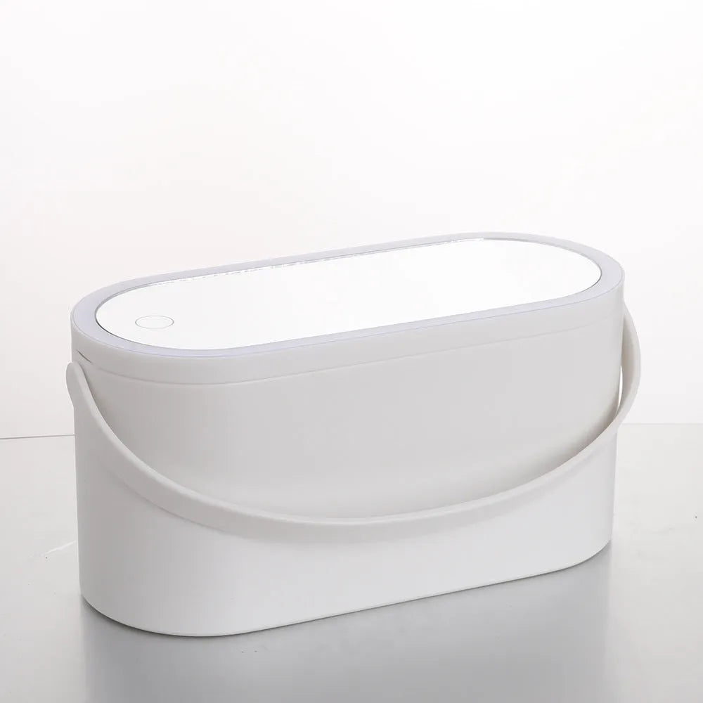 Pink gradient portable LED makeup mirror storage box with open lid showing silver mirror and storage compartment.