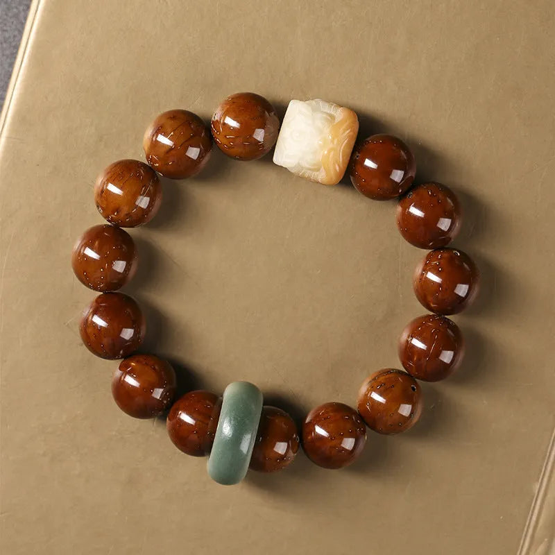 Hand-woven beaded circle bracelet with 13mm round beads in ivory nut, sandalwood, or yellow gradient bodhi style.