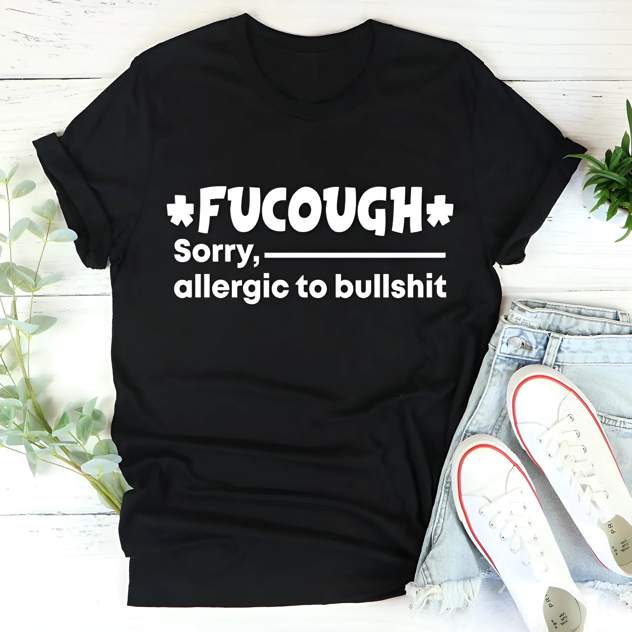 Black cotton loose fit t-shirt with round neck and short sleeves on hanger