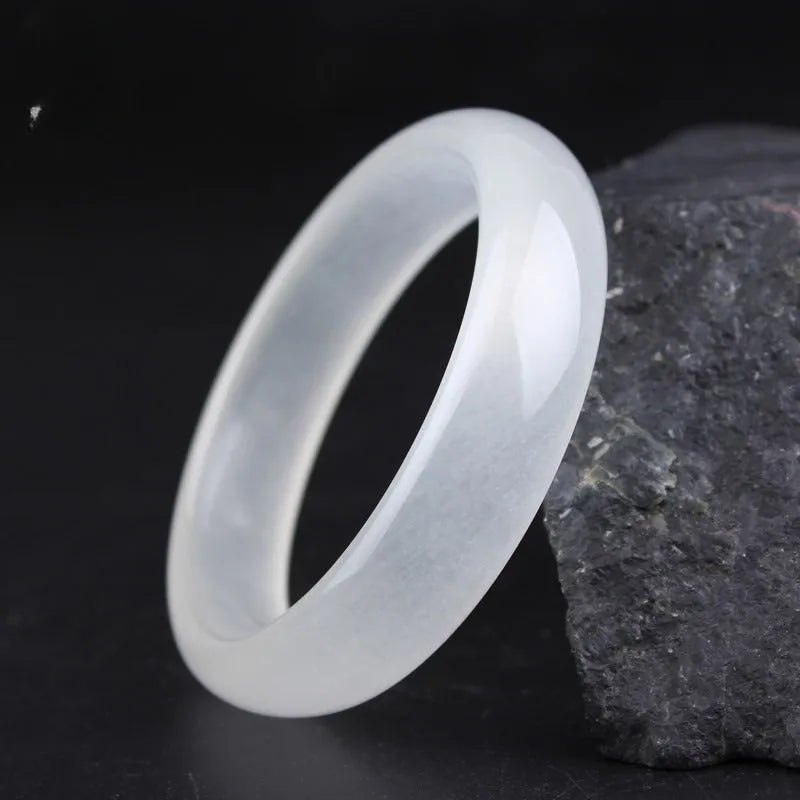 Gao Bing jade bracelet in ice-like white moonlight colour on a wrist, showing flat rod and round rod style options.