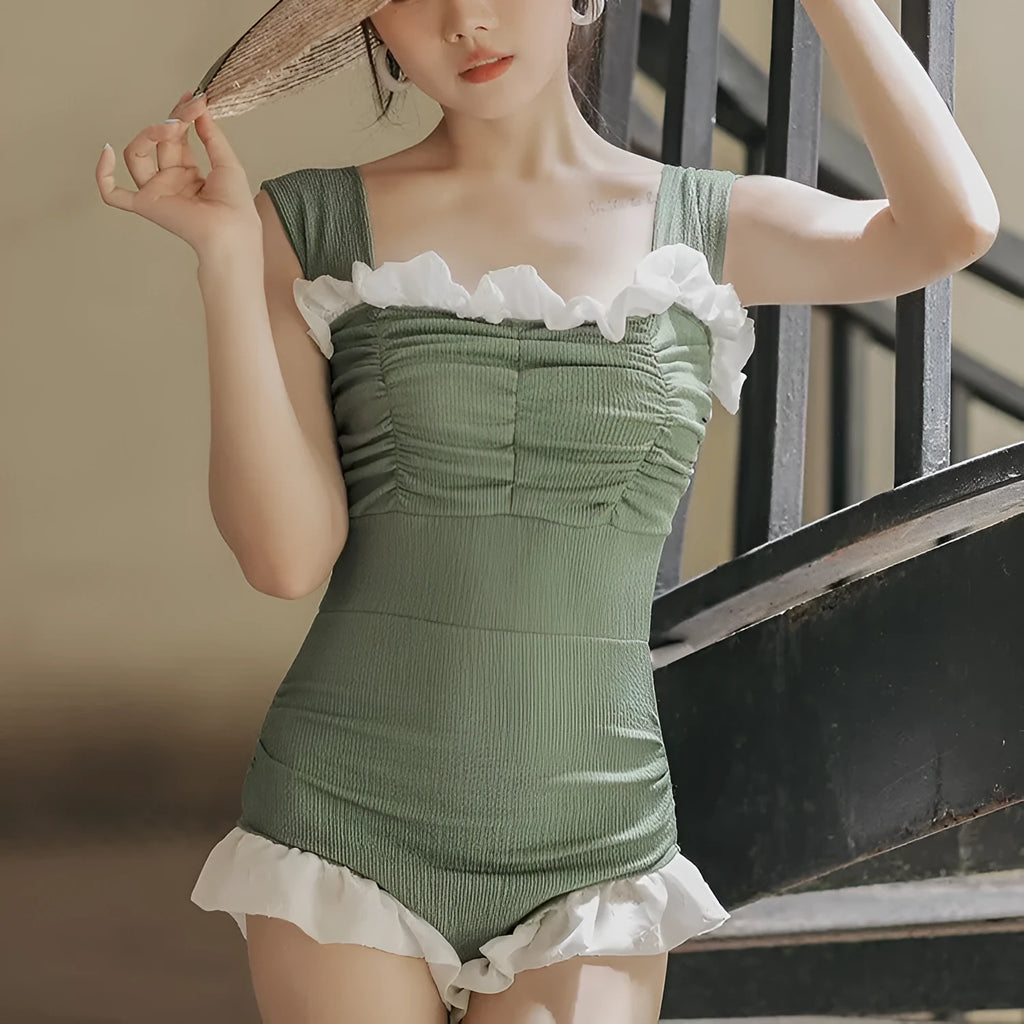 Korean style triangle top one-piece swimsuit for women with high waist in black colour.