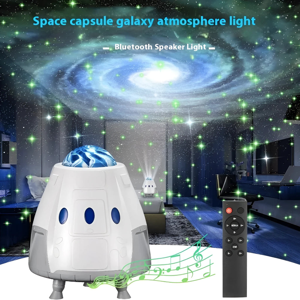 Space Capsule USB Galaxy Projection Lamp in white or grey with remote control on a table.