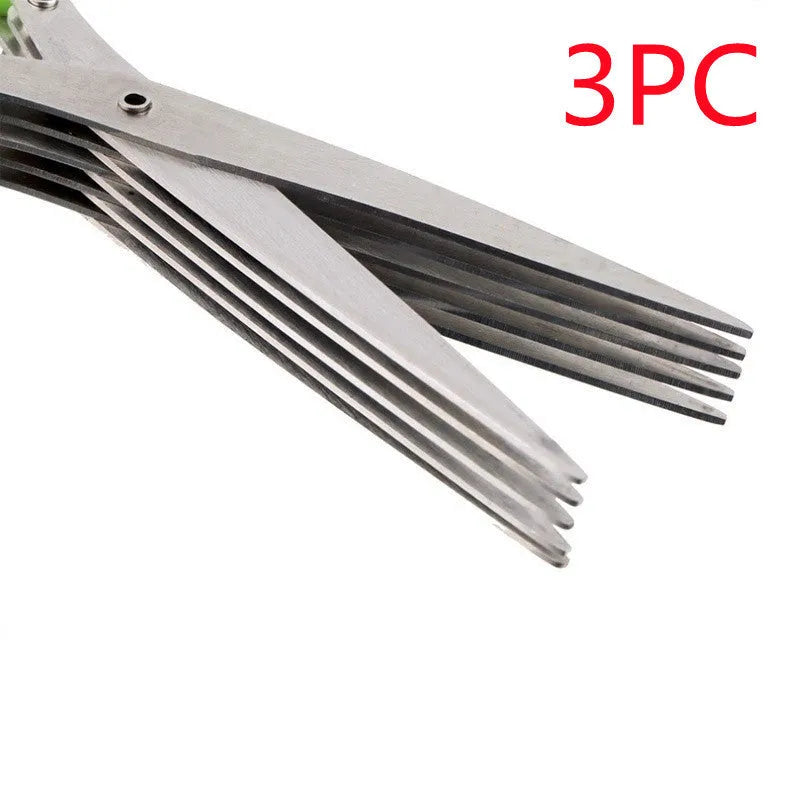 Stainless steel multi-blade kitchen scissors for cutting onions and herbs on a chopping board.