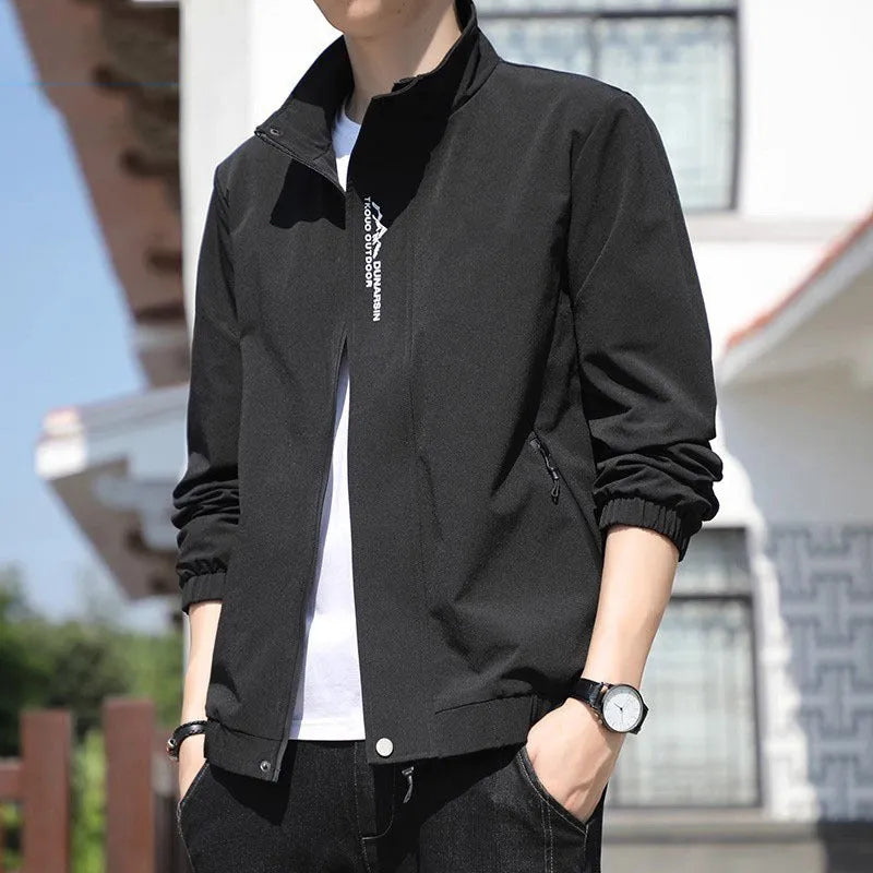 Men's black stand collar casual sports coat with straight hem and long sleeves on a hanger.