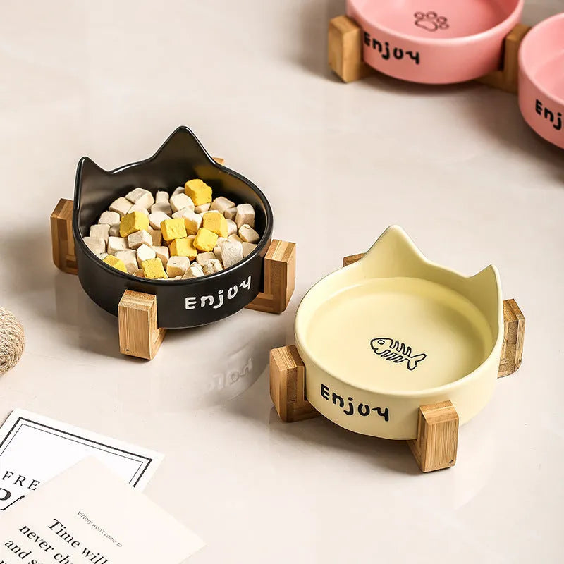 Porcelain cat bowl with cat ears rim and wooden anti-tumble frame in selected colour