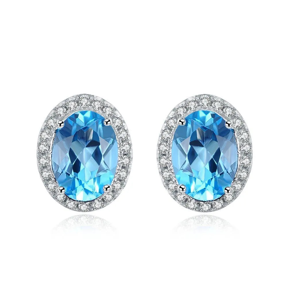 Geometric sterling silver jewellery set with blue topaz gems including earrings, ring, pendant and necklace