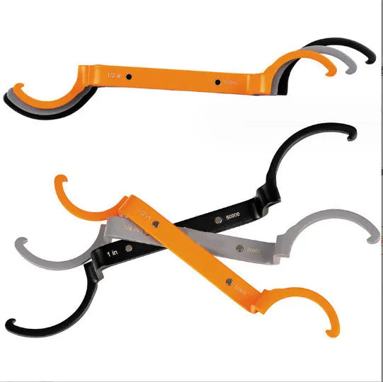 Three magnetic crescent wrenches with orange, grey and black handles showing suction and locking features