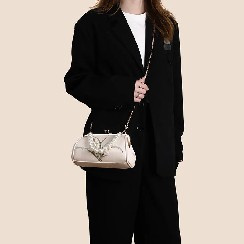 Beige embroidered women's shoulder bag with shell-shaped design in soft PU leather