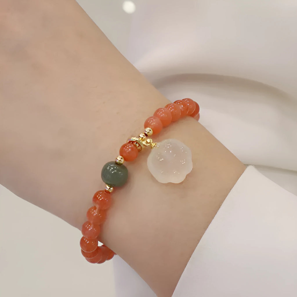 Natural red agate bracelet with cat paw design and jade accent stones