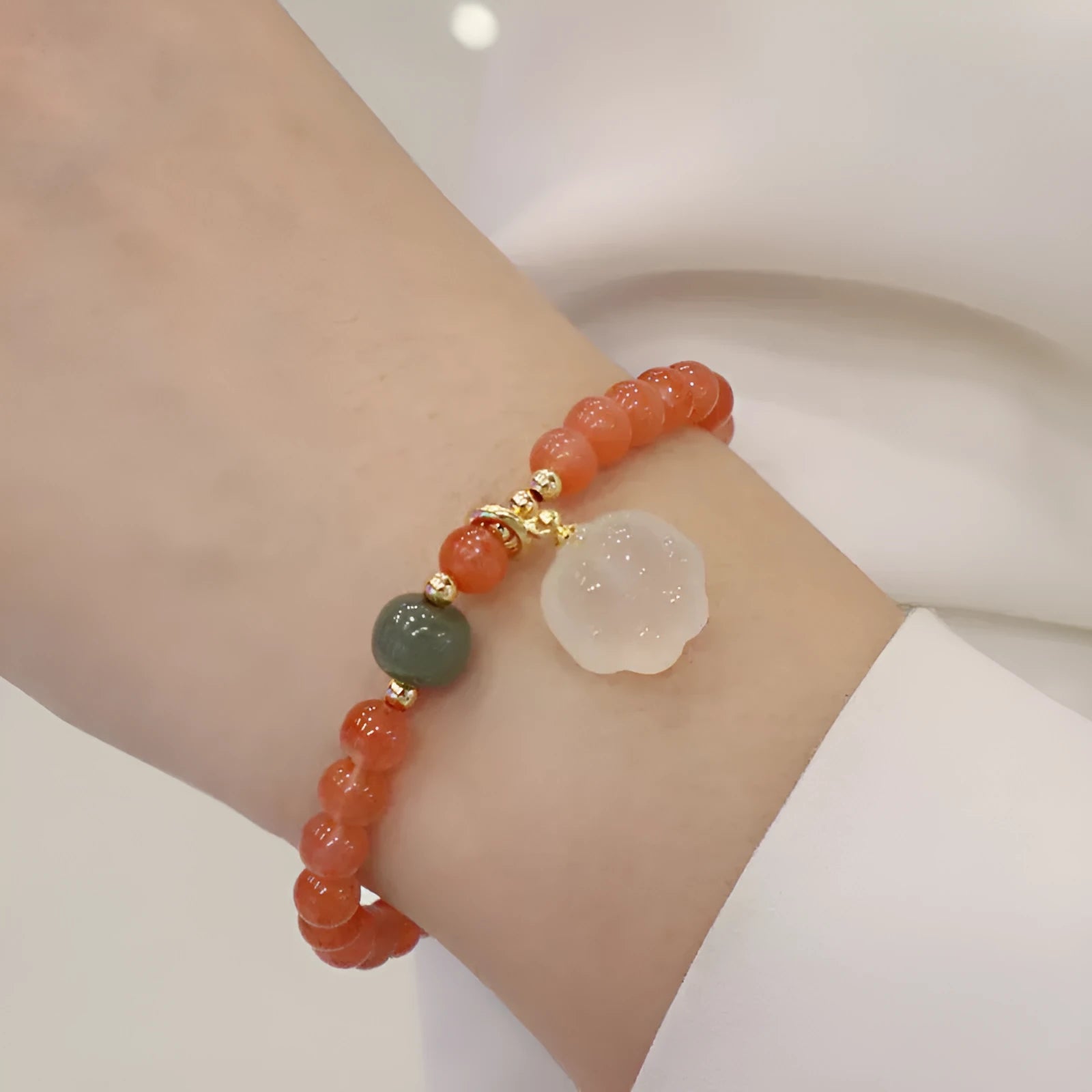 Natural red agate bracelet with cat paw design and jade accent stones