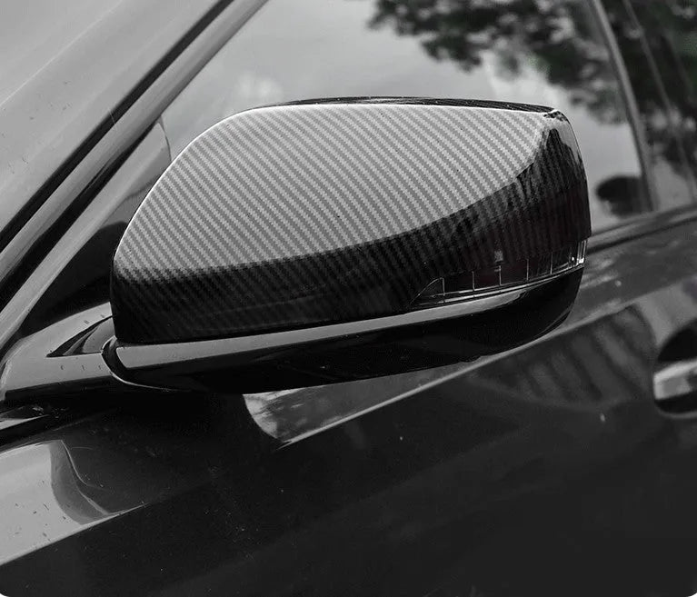 Set of ABS plastic mirror covers for Cadillac CT5 CT6 in carbon fibre, silver, and rain frame styles.